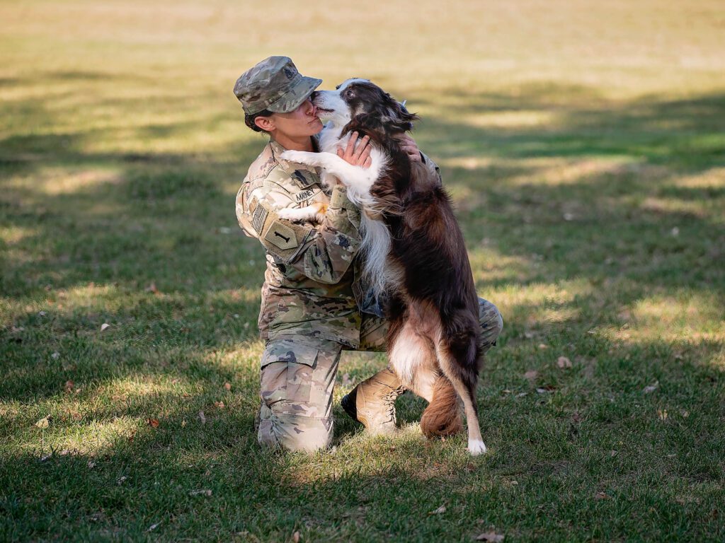 Army servicewoman greeting her dog after being deployed in Kuwait for 11 months.